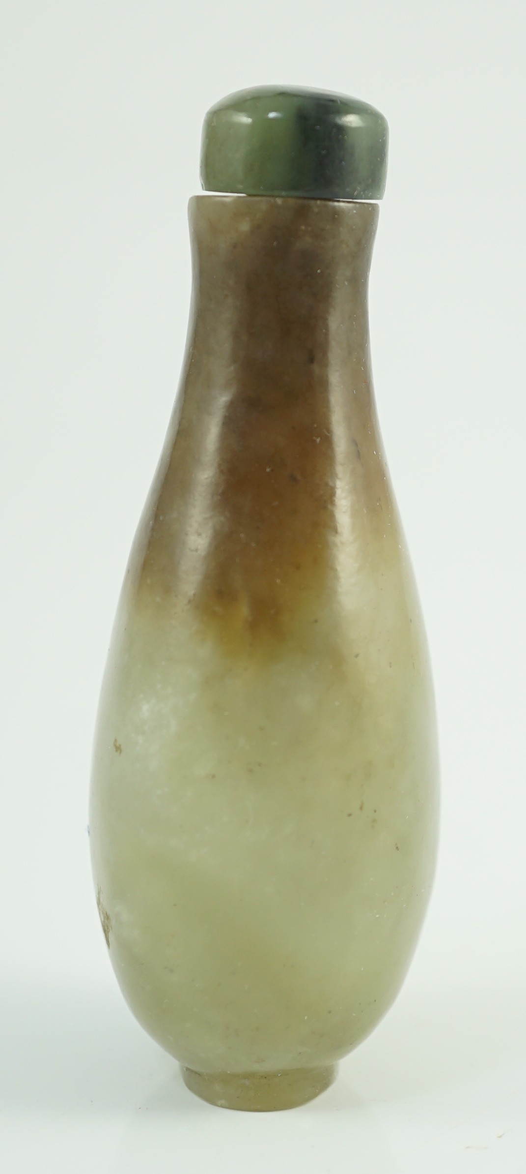 A Chinese celadon and brown jade pear form snuff bottle, 19th century, 7.2cm high